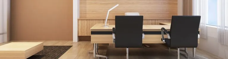 Expansive desk inside of a business office.