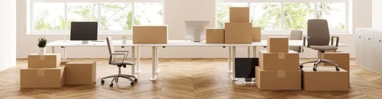 Inside of an office with boxes packed, ready for a move.