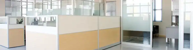 Inside of an office with cubicles.